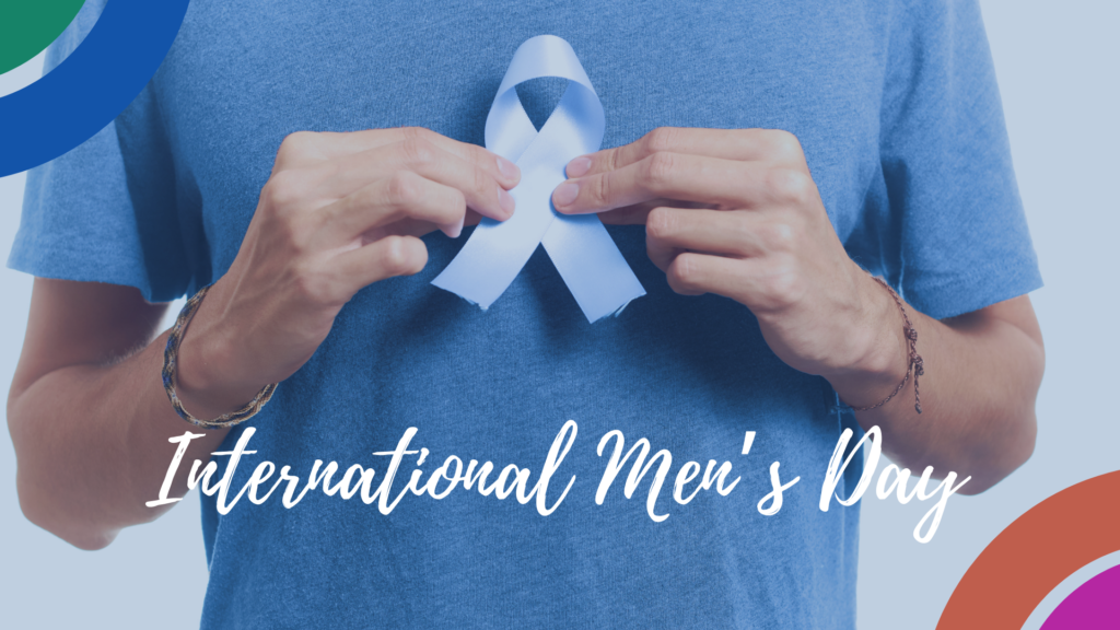 A man holding a blue ribbon with the words international men's day.