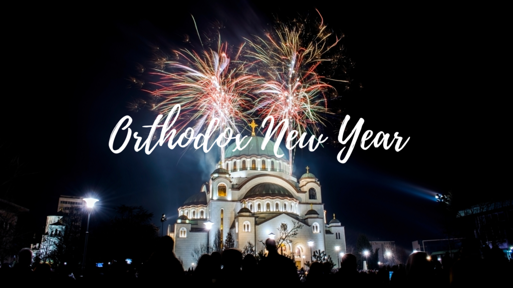 A church with fireworks in the background and the words orthodox new year.