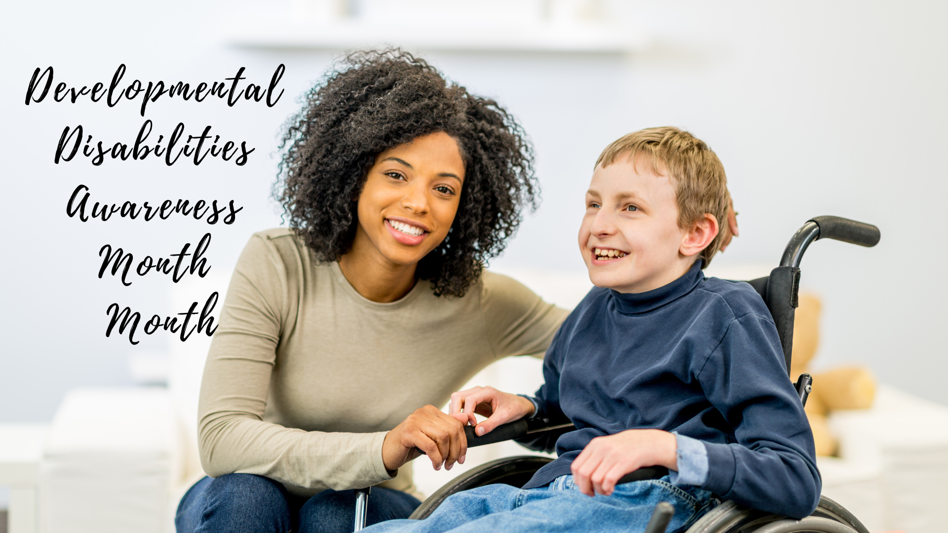 A woman and a boy in a wheelchair.