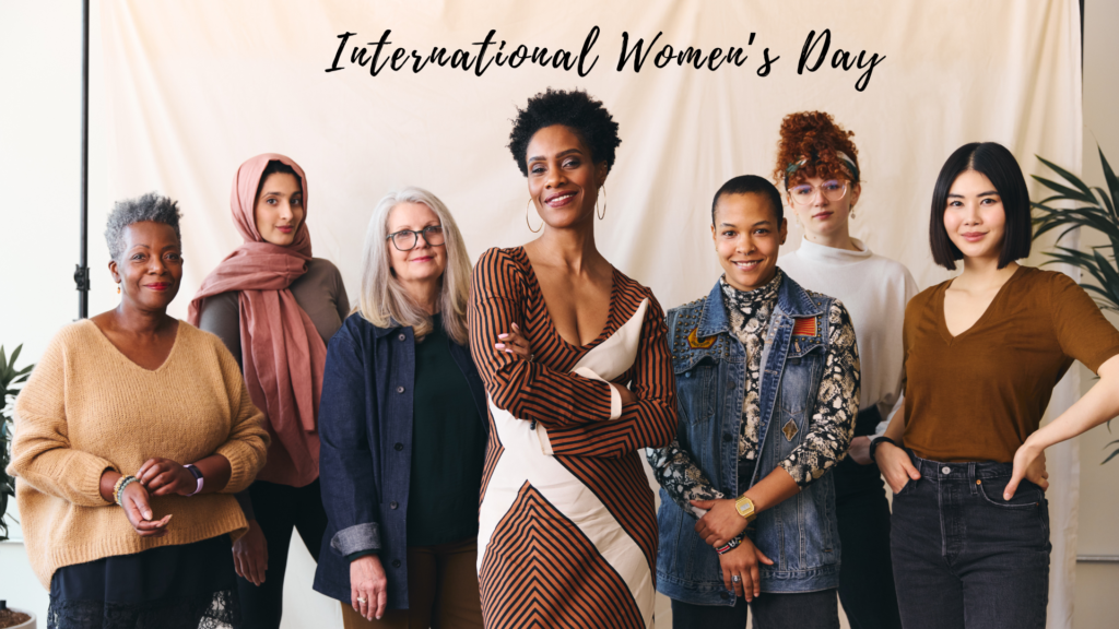 A diverse group of women stand together in solidarity, celebrating international women's day.