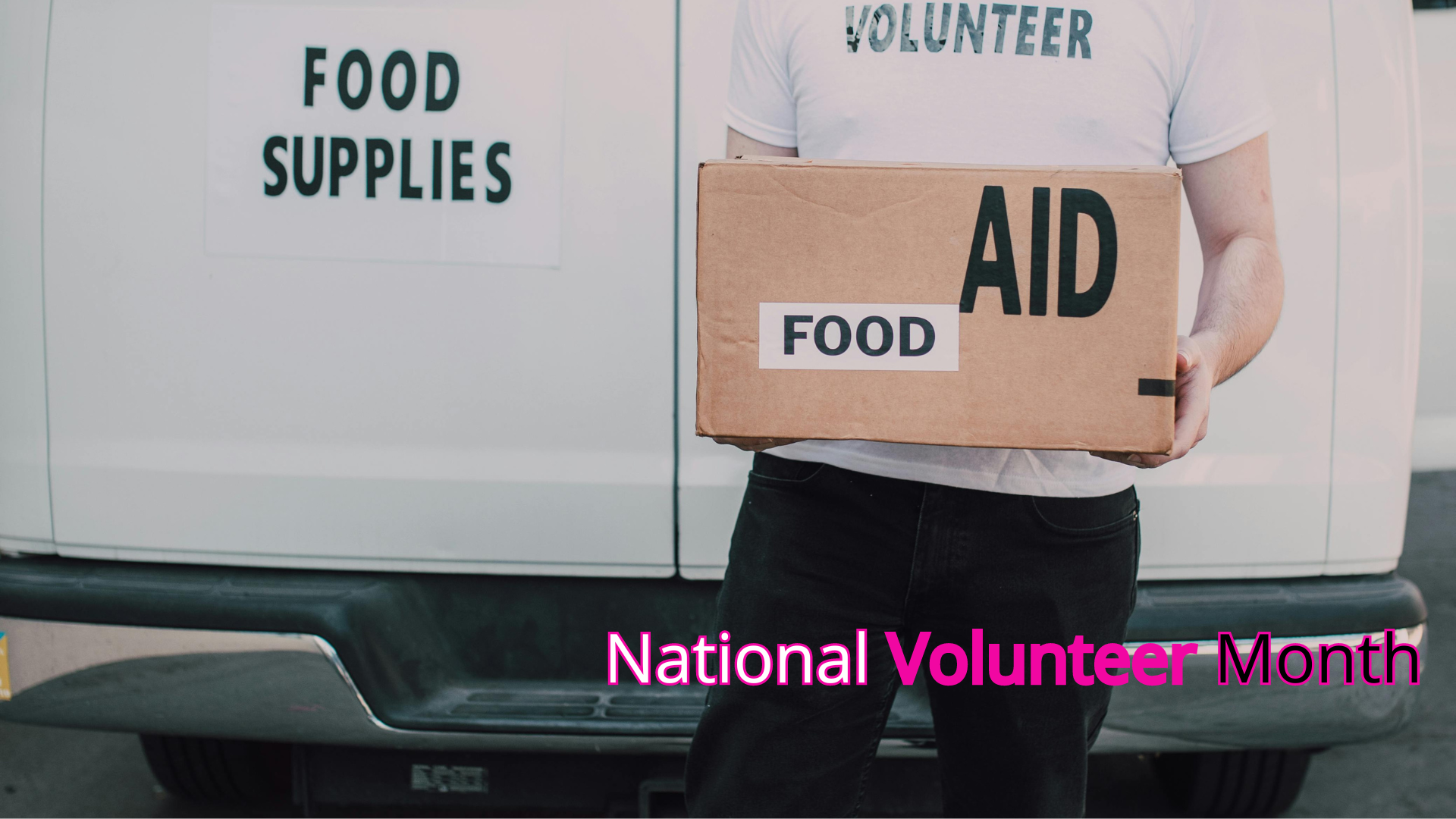 Volunteer loading food supplies into a van during national volunteer month.