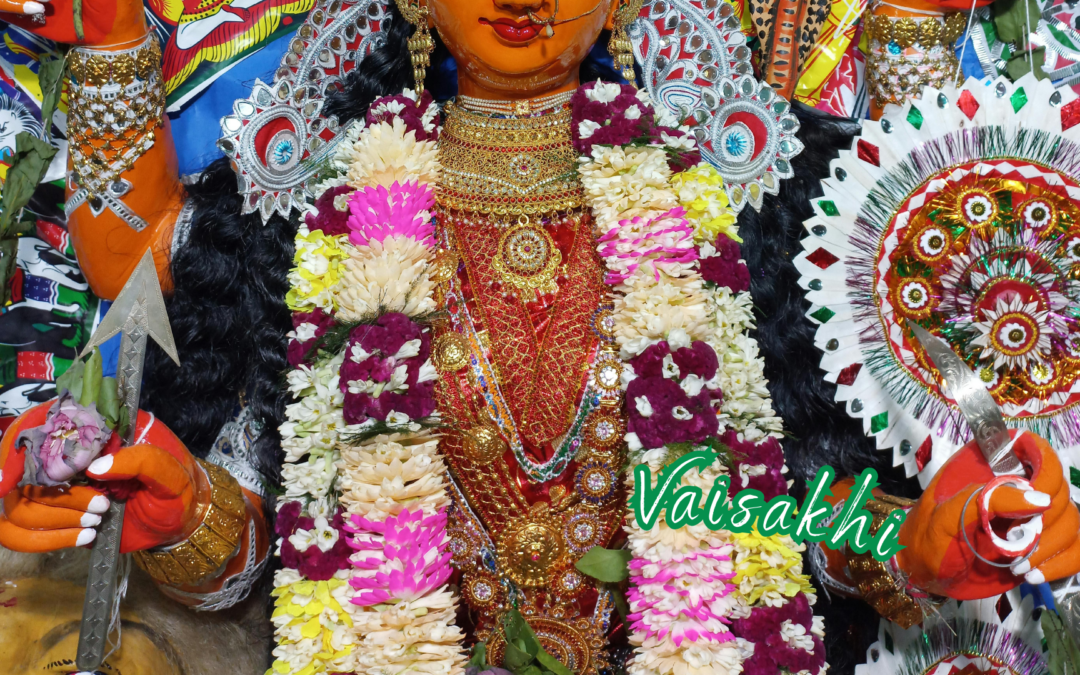 Colorfully adorned deity figure at vaisakhi festival with vibrant flowers and embellishments.
