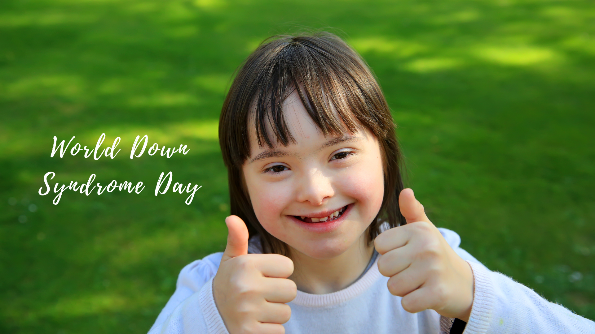 Cheerful girl giving thumbs up outdoors with text 'world down syndrome day'.