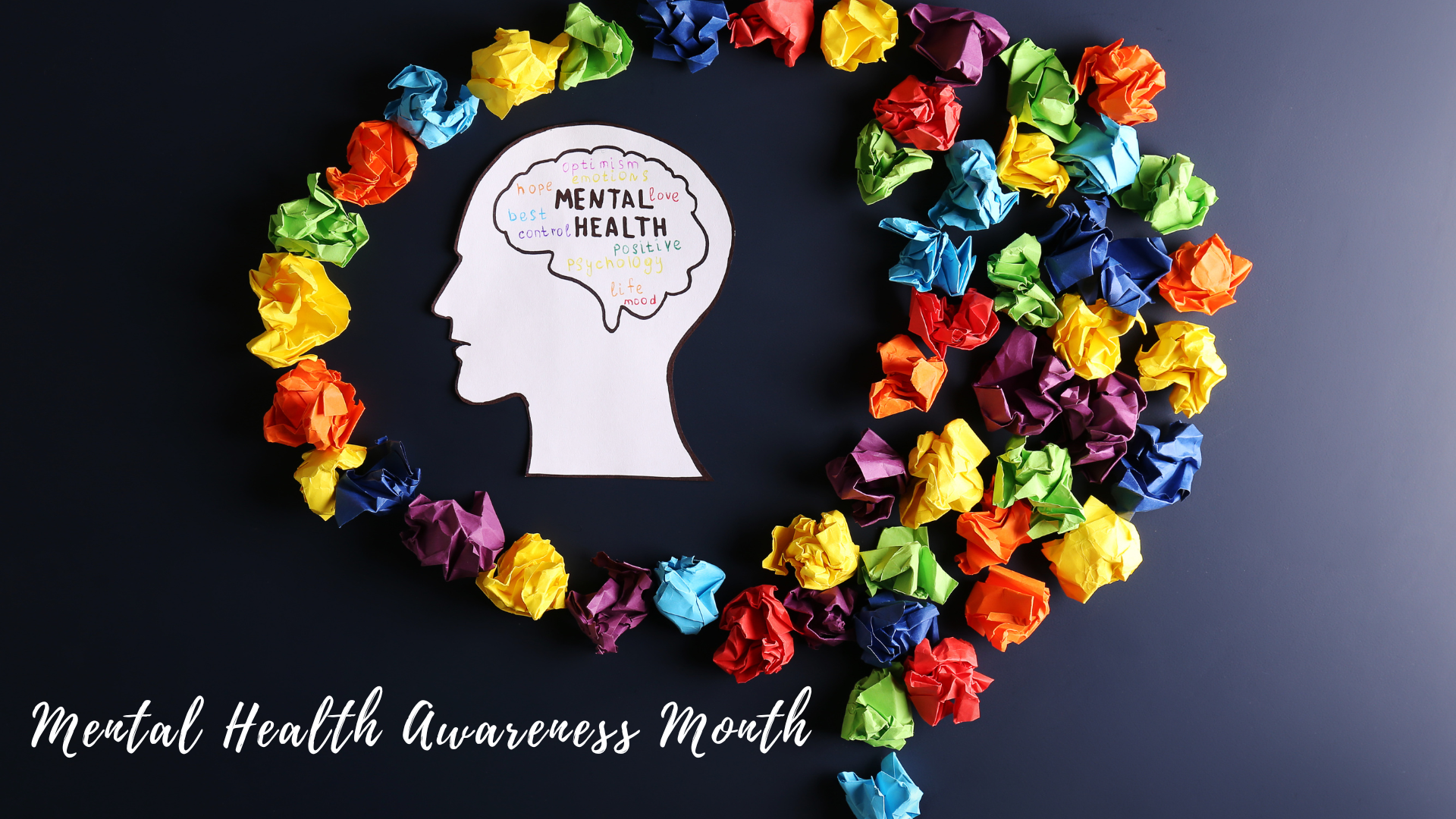 A graphic of a human head silhouette surrounded by a circle of colorful crumpled paper balls, symbolizing mental health awareness month.