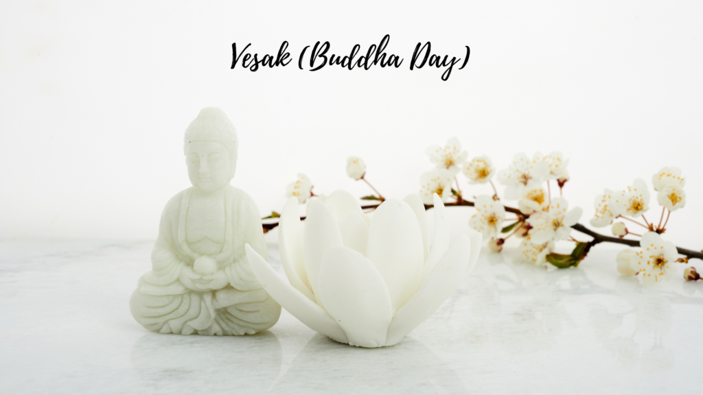 Statue of buddha and a white lotus flower with vesak (buddha day) text and cherry blossoms on a light background.