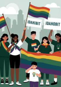 A diverse group of people holds rainbow flags and signs reading "IDAHOBIT" at an outdoor event, with a city skyline in the background.